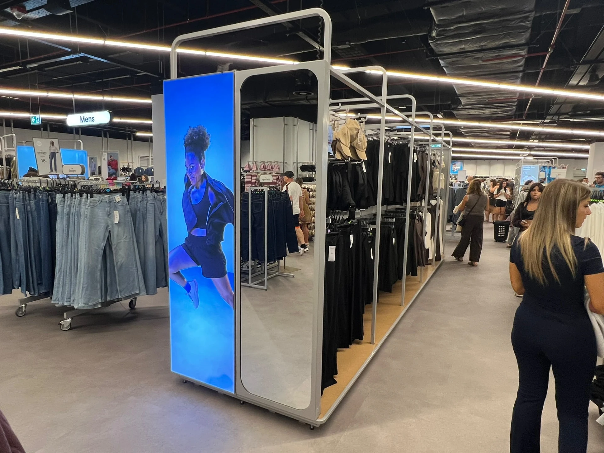 Freestanding illuminated fashion display inside Primark Pompeii