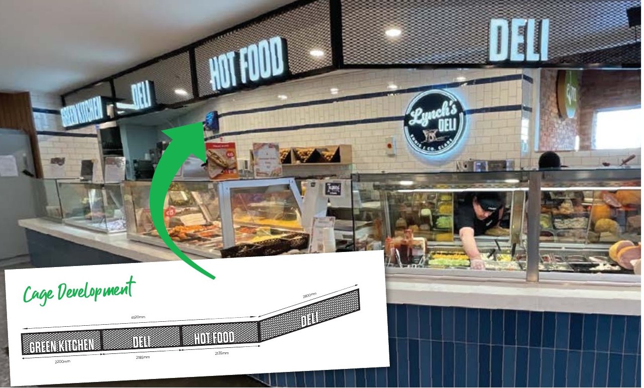 Centra deli cage development showing the overhead framework and illuminated department signs