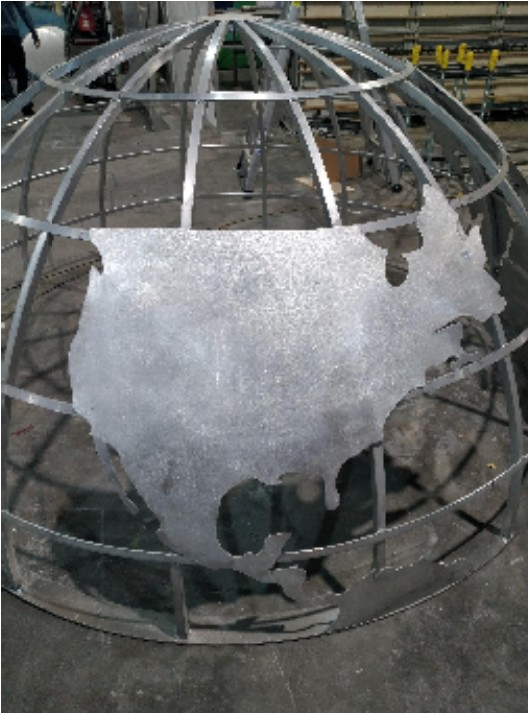 Aluminium sheet continent fitted to the globe frame during fabrication