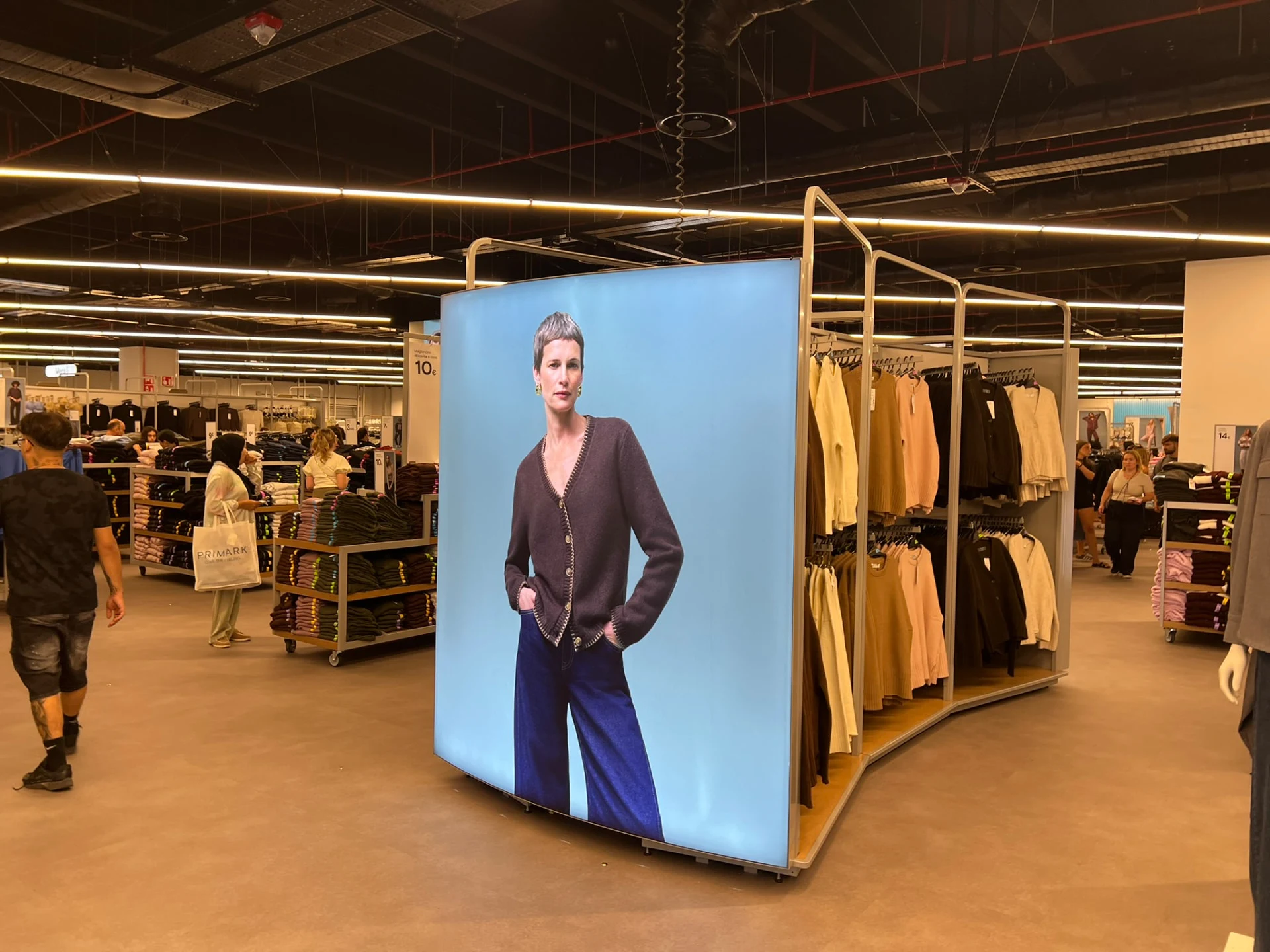 Illuminated fashion graphic on a freestanding retail display
