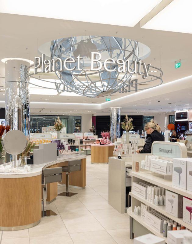 Planet Beauty globe suspended over the beauty counters at Brown Thomas Dundrum