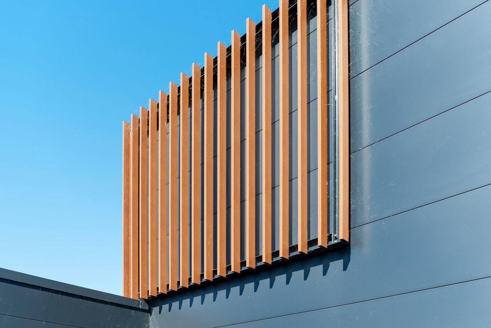 Anthracite aluminium slat cladding on a modern building façade