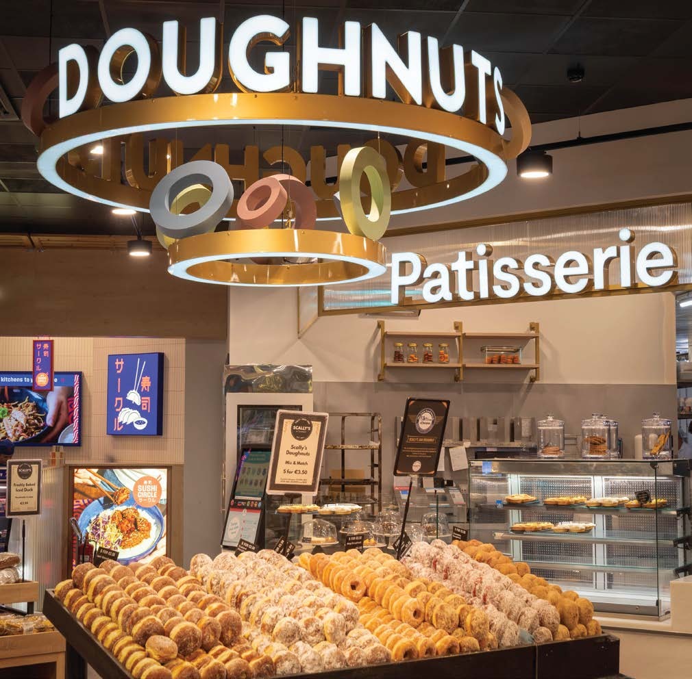 Illuminated DOUGHNUTS lettering and pastel suspended rings at Scally’s SuperValu