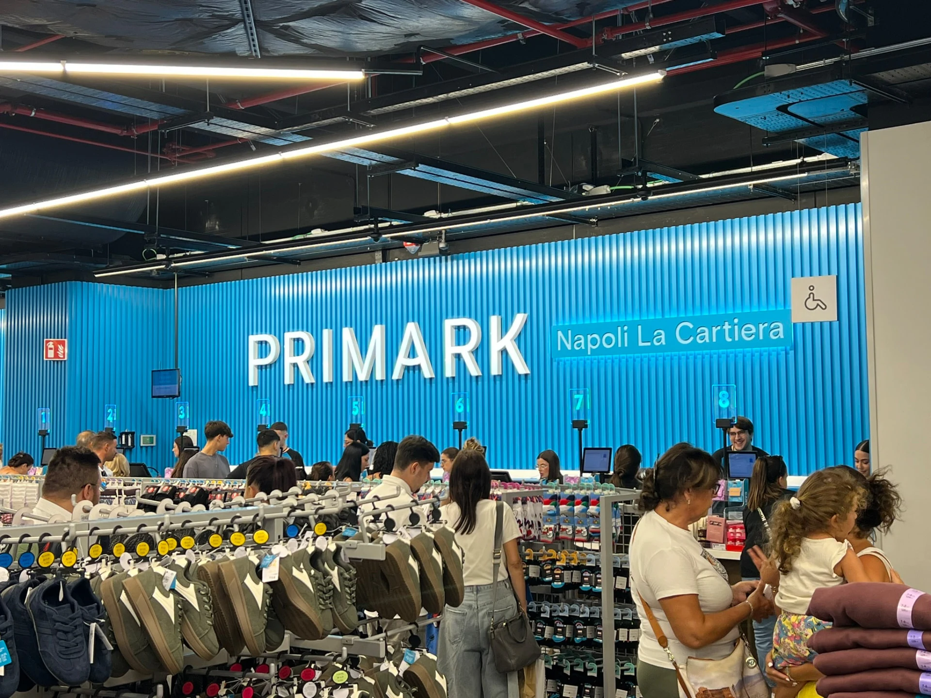 Primark Napoli La Cartiera checkout wall and numbered tills