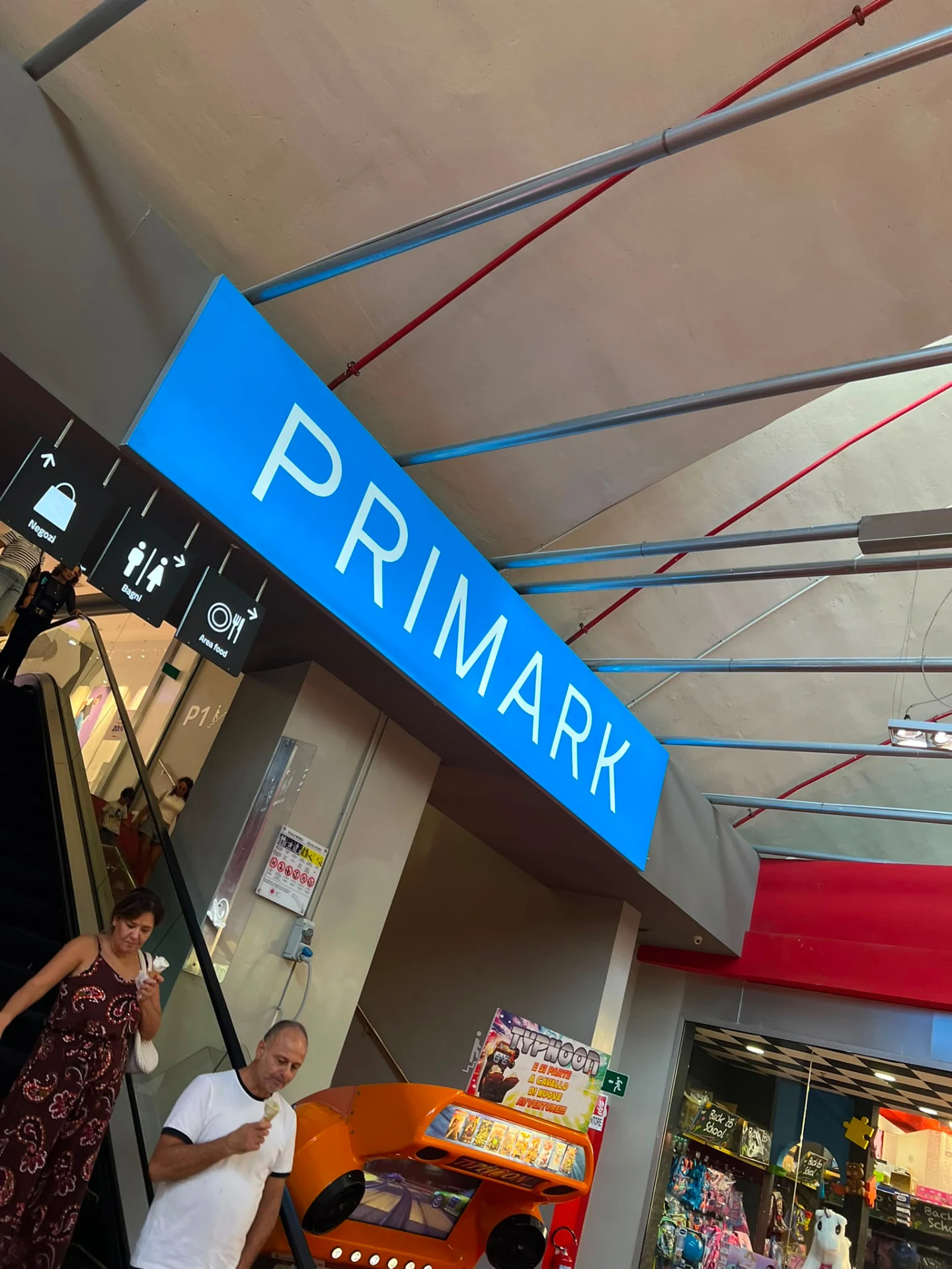 Primark overhead sign and directional signage in La Cartiera